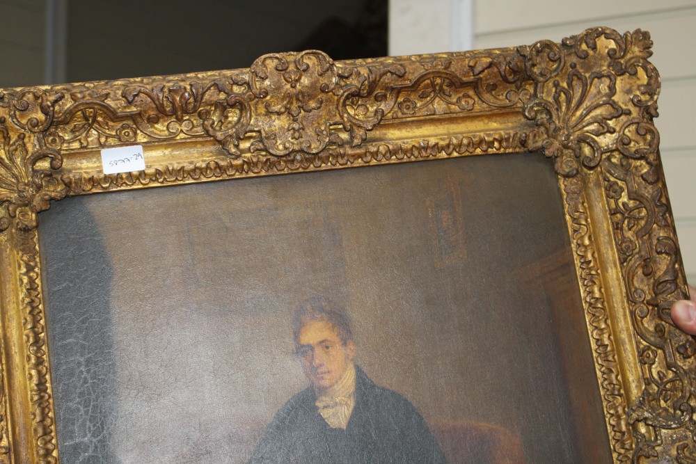 Early 19th century English School, oil on canvas, Full length portrait of a gentleman seated beside a writing slope, 53 x 40cm